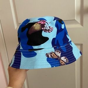 2 camouflage Butterfly Bucket Hats in blue and pink